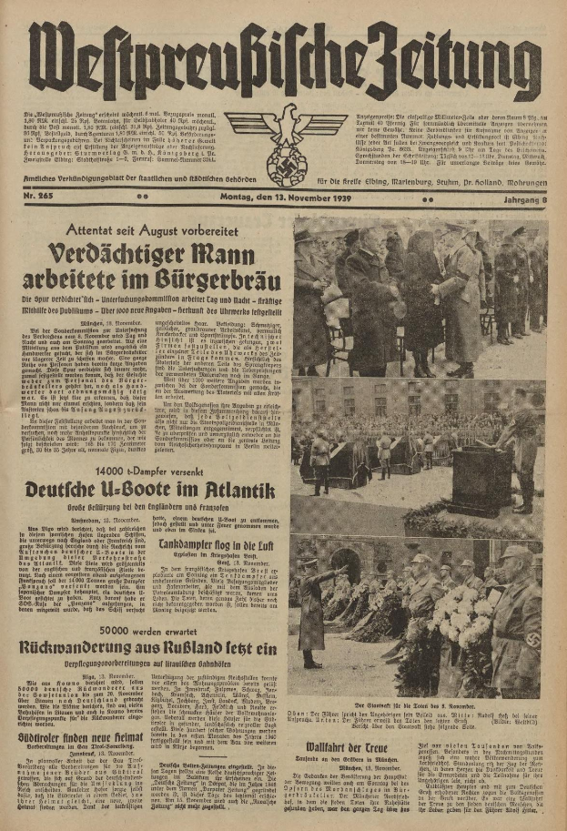 Schwarze-Weiß-Titelseite einer deutschen Zeitung vom 13. November 1939 mit der Überschrift 'Weitpreubliche Zeitung', die eine Gruppe von Menschen in traditioneller deutscher Kleidung in einer feierlichen Atmosphäre zeigt.