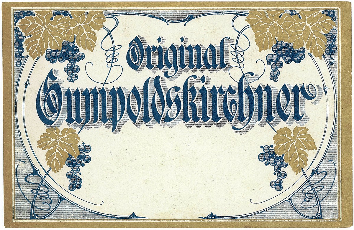 Alte deutsche Wein-Etikett mit einer Abbildung von Trauben und Blättern, mit Text, der den Wein-Typ angibt.