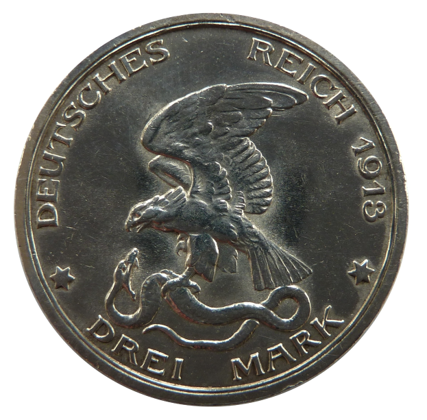 Silbermünze mit einem ausgebreiteten Adler, der eine Schlange hält, Text "Deutsches Reich" auf weißem Hintergrund.